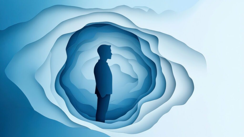 Photo d'un personnage bleu foncé sur fond bleu clair.